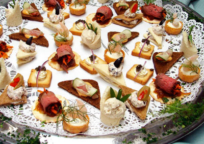 Assorted hors d'oeuvres plate with meats, cheese, and vegetables